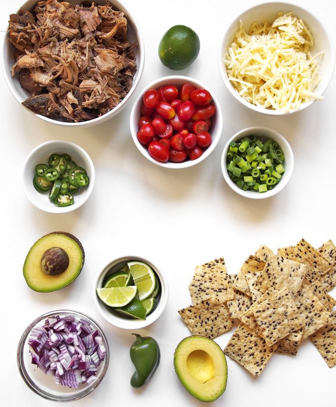 Chili lime roasted pork combines with your favorite nacho fixins for a way better meal.