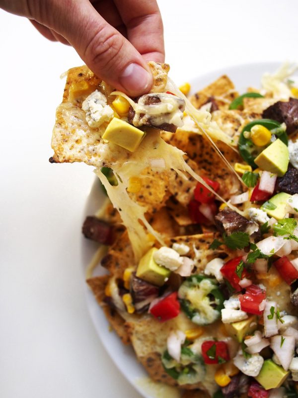 Dive in to all the finger-licking goodness of these steak nachos.
