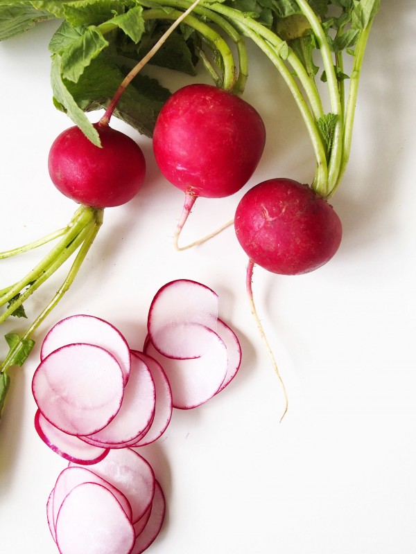 Spring radishes steal the show on this veggie-forward nacho pizza.